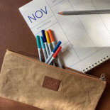 out of the woods trousse beige out of the woods trousse beige